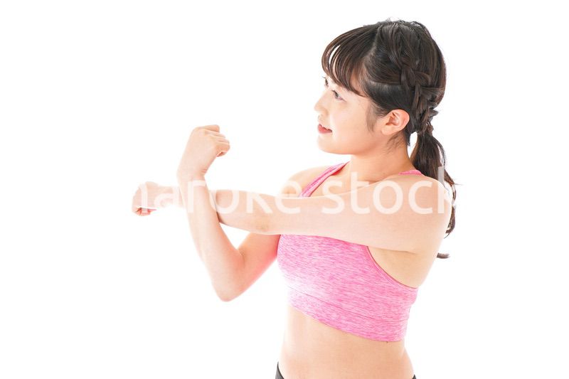 ウォーミングアップをする若い女性