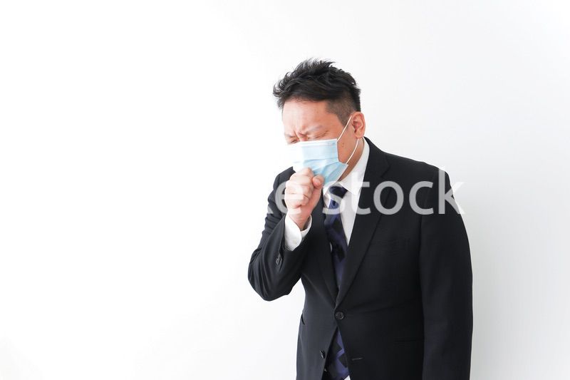 体調に不安を感じるビジネスマン