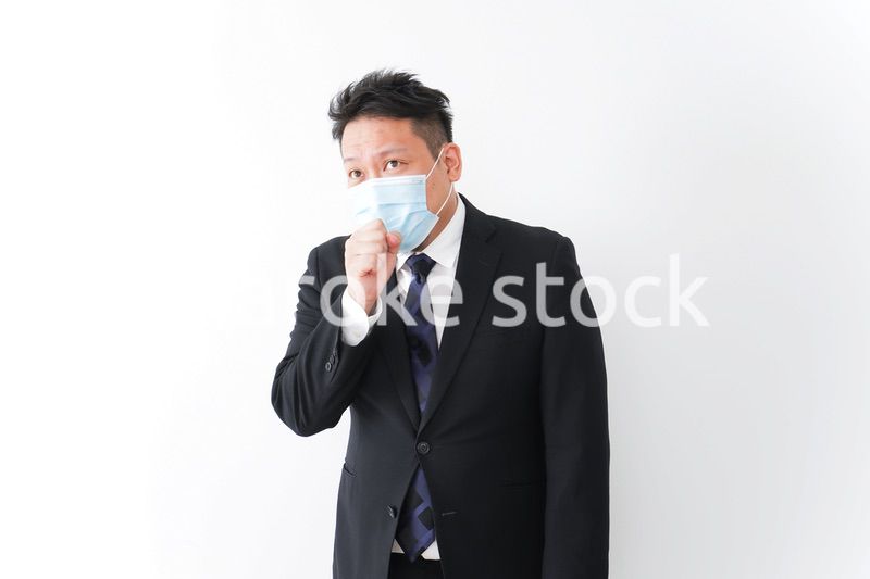 体調に不安を感じるビジネスマン
