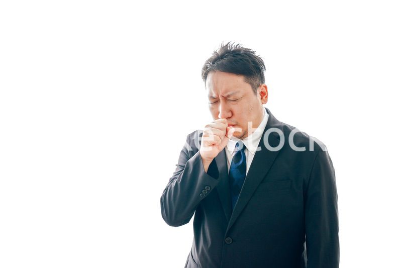 熱を出すスーツを着た中年男性